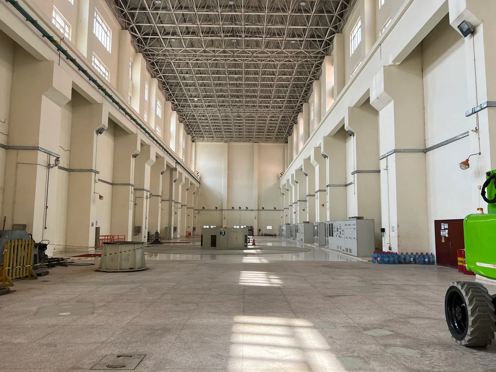 Hydropower turbine hall with electrical cabinets and generator bay